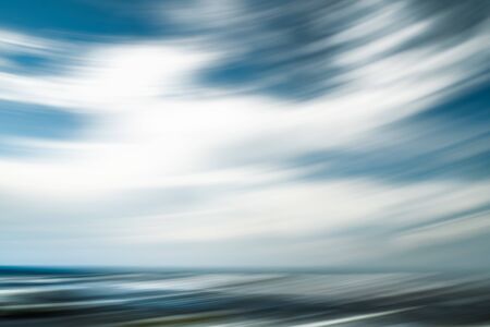 Breezy  weather abstract. Cloudy sky and ocean view. Line art, motion blur, blue, turquoise colorsの写真素材