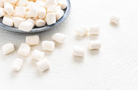 Marshmallows close up on white background, copy spaceの写真素材