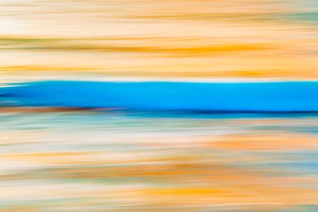 Abstract background. Tropical beach sunset. Yellow and blue colors, motion blur, line artの写真素材