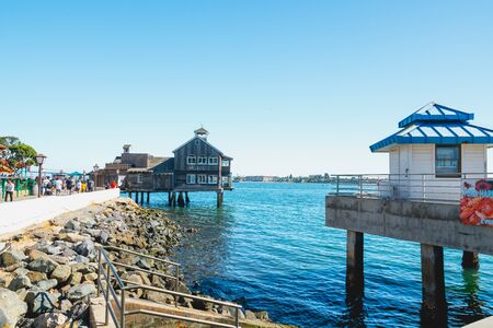 San Diego, California/USA - August 14, 2019  Seaport Village, Marina District of Downtown San Diego. Promenade, restaurants, walking people. Beautiful sunny day, clear sky backgroundのeditorial素材