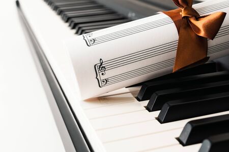 Piano Keyboard and Music Sheet close up. Music Instrument, romance, gift,  conceptの写真素材