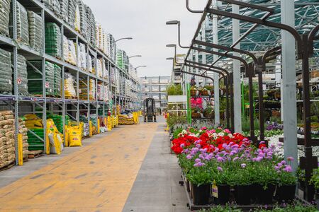 Santa Maria, California/USA - February 22, 2020.  Garden center and floral market. Variety of flowers, trees, plants, different types of potting soil and organic fertilizersのeditorial素材