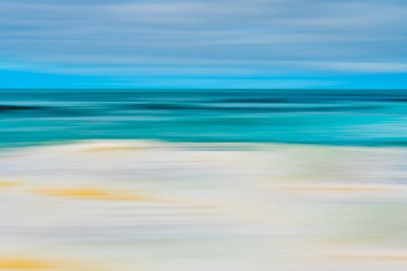 Abstract seascape background. Stormy ocean, and beautiful cloudy sky. Line art, motion blur, blue, turquoise, yellow colorsの写真素材