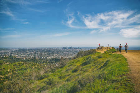 Los Angeles, California/USA - April 8, 2018 Griffith Park hiking trail. The area is famous for its Hollywood sign, Griffith Observatory, and spectacular views of downtown Los Angelesのeditorial素材