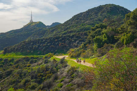 Los Angeles, California/USA - April 8, 2018 Griffith Park hiking trail. The area is famous for its Hollywood sign, Griffith Observatory, and spectacular views of downtown Los Angelesのeditorial素材