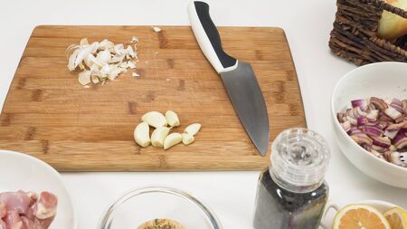 Garlic close up on a wooden chopping boardの写真素材