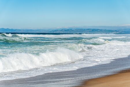 Beautiful seascape. Blue waves breaking on the shore.の写真素材