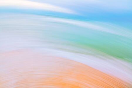 Sunny day on the beach.  Abstract landscape background. Soft, light blue, cyan, and yellow colorsの写真素材