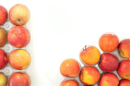 Fresh red apples close up on white background with copy space, view from aboveの写真素材