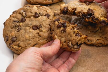 Chocolate chip cookies with pine nuts. Homemade old-fashioned Chocolate Chip Cookies close up. American cuisine, dessertの写真素材