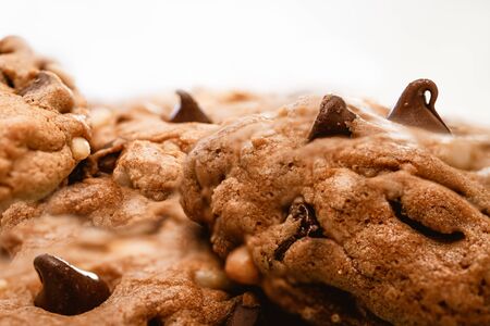 Chocolate chip cookies with pine nuts. Homemade old-fashioned Chocolate Chip Cookies close up. American cuisine, dessertの写真素材