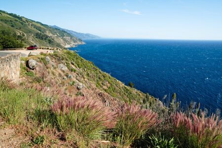 Big Sur, California. Scenic overview of Pacific ocean, rocky cliffs, and native plants on the beach.の写真素材