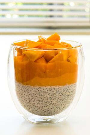 Chia seeds layered pudding with yogurt and fresh mango.の写真素材