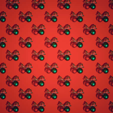 Red Christmas pattern. Red and green satin glass Christmas bulbs on red backgroundの写真素材