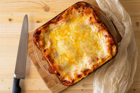 Spinach Lasagna. Home made delicious spinach lasagna with cheese layered between pasta sheets close up, view from aboveの写真素材