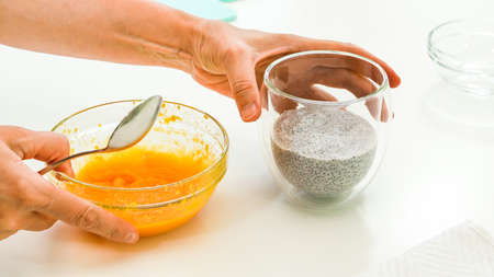 Mango puree. Mango Chia seed layered pudding smoothie step by step recipe. Vegan healthy breakfast, dessertの写真素材