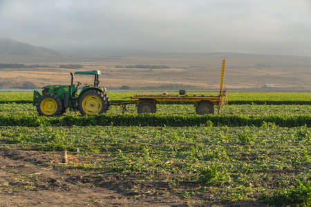 Santa Barbara County, California/USA - July 7, 2020
Agricultural field and agricultural machines. Tractor at sunset standing on the field after working dayのeditorial素材