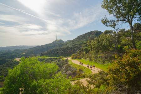 Los Angeles, California/USA - April 8, 2018 Griffith Park hiking trail. The area is famous for its Hollywood sign, Griffith Observatory, and spectacular views of downtown Los Angelesのeditorial素材