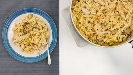Pasta with mushrooms, chicken meat and Alfredo sauce recipeの写真素材