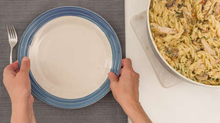 Pasta with chicken, mushrooms, and Alfredo sauceの写真素材