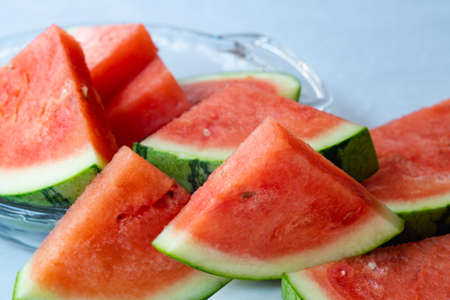 Watermelon slices close up on kitchen tableの写真素材