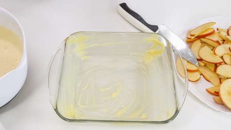 Biscuit batter preparation process. Baking form and some ingredients close up on a kitchen tableの写真素材