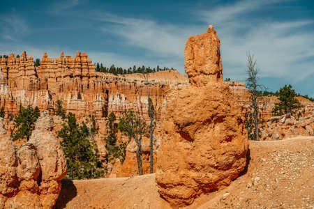 Red rock sandstone formation in Bryce Canyon National Park, Utah, and cloudy sky backgroundの写真素材