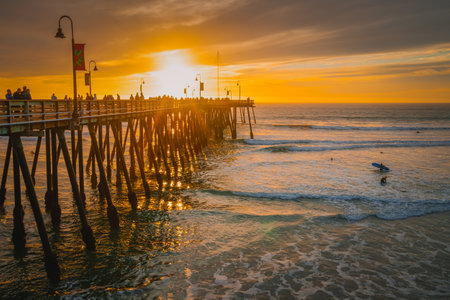 Pismo Beach, California,USA - January 1, 2021 Pier that stretches toward the setting sun, panorama. An iconic California wooden pier at 1, 370 feet long in the heart of Pismo Beach cityのeditorial素材