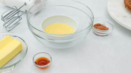 Chocolate cream frosting for chocolate cake step by step recipe. Ingredients close up on kitchen...