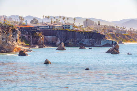 Pismo Beach cliffs with palm trees,  and silhouette of hotels overlooking the Pacific Ocean. San Luis Obispo County, California Central Coastのeditorial素材