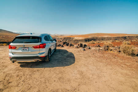 Death Valley, California, USA- April 13, 2021  Car in desert. Padre Crowley Point at 4000 feet in...