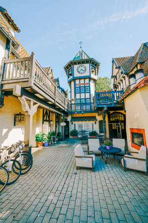 Solvang, California, USA - May 29, 2021   Tivoli Square Clock Tower in Solvang, a City in Southern California's Santa Ynez Valley. The city has known for its traditional Danish style architecture, vertical bannerのeditorial素材