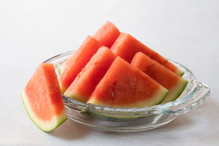 Bowl of watermelon slices on kitchen table, fruit salad, healthy dessert