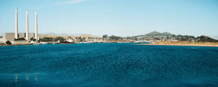 Morro Bay, California, USA - May 27, 2021 Morro Bay, small cozy town in Central California Coast. An old power plants, waterfront, and cityscape on background, panoramaのeditorial素材
