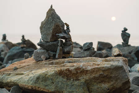 Rocks on the beach at sunset. Balance and harmony concept