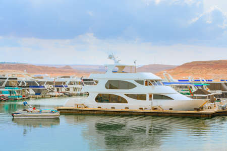 Lake Powell, Utah, USA - September 29, 2021 Yachts and houseboats moored on Lake Powell, Sothern...