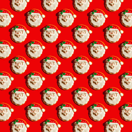 Santa Claus Christmas ornaments pattern, red background. Creative square pattern, flat layの写真素材