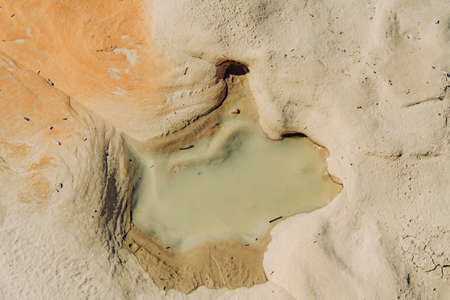 Water hole in rocks in desert after rain seasonの写真素材