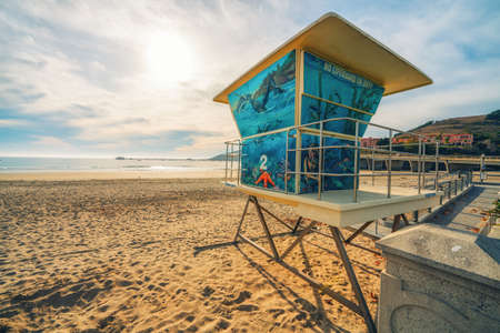 Lifeguard tower on the beach in a bright sunny day with beutiful cloudy sky on backgroundの写真素材
