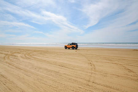 Oceano, California, USA - February 27,  2022.  Cars on the beach. Oceano Dunes, California Central Coast, the only California State Park that allows  vehicles to drive on the beachのeditorial素材
