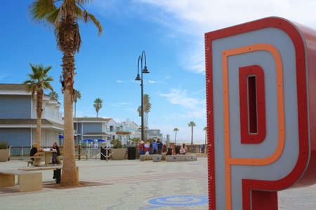 Pismo Beach, California, USA - March 3, 2022. Pismo Beach Pier plaza. The large light-up letters, a new neon landmark of Pismo Beach city, Californiaのeditorial素材