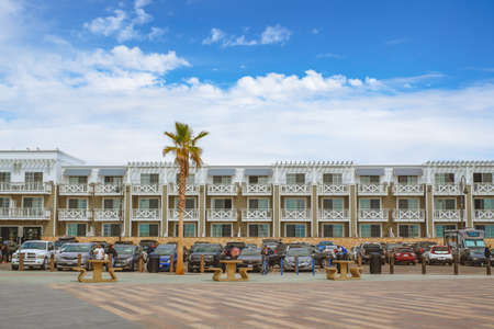 Pismo Beach, California, USA - March 3, 2022.  Inn at the Pier hotel, located just footsteps from the pier and boardwalk. Hotel with ocean view overlooking the Pismo Beach pierのeditorial素材