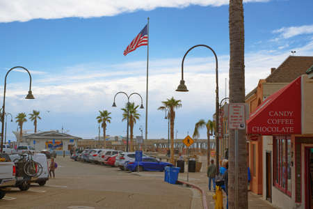 Pismo Beach, California, USA - March 3, 2022. Pismo Beach Pier plaza. Shops, restaurants, walking...