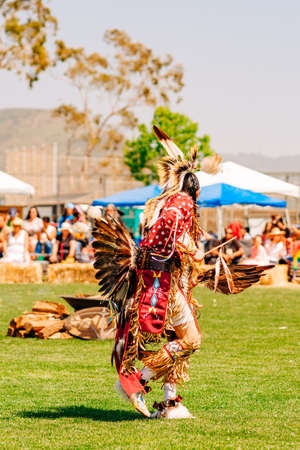 Malibu, California, USA - April 9, 2022. Powwow. Native American Male Dancers at Pow-Wow in Malibu, California. Native Americans dressed in full regalia.   Chumash Day Powwow and Intertribal Gathering.のeditorial素材
