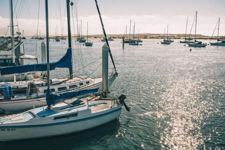 Morro Bay, California, USA - February 16, 2022.   Sailing boats moored in Morro Bay harbor.のeditorial素材