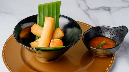 Crispy veggie rolls. Traditional Chinese Thai restaurant appetizer, spring rolls  filled with...