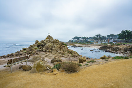 Monterey County, California, USA - October 31, 2022. Monterey bay rocky beach, pretty cloudy dayのeditorial素材