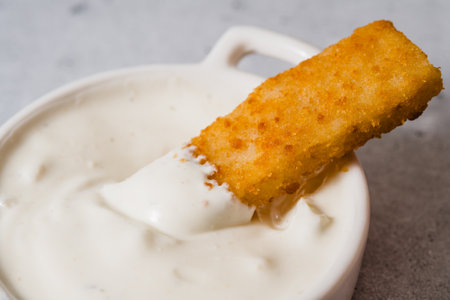 Crunchy breaded fish stick made from wild caught Alaskan Pollock dipped in greek yogurt garlic...