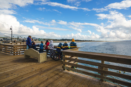 Pismo Beach, California - December 6, 2022.  Pismo beach during ISA World Para Surfing Championship. Supporters on the pierのeditorial素材