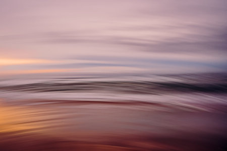 Motion blur abstract seascape in magenta colors. Sunset over the seaの写真素材
